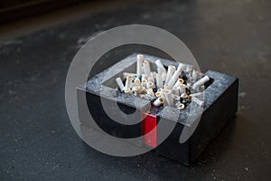 Ashtray full of cigarettes