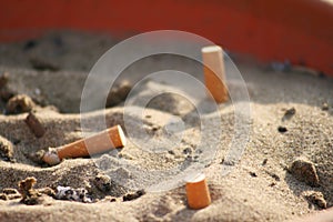 Ashtray in sand photo