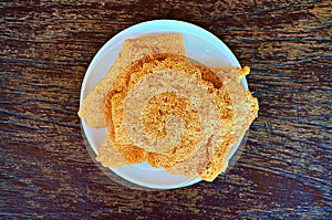 Closeup of Rice CracKer with Flossy Pork photo
