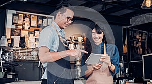 Asia Barista waiter take order from customer in coffee shop,cafe owner writing drink order at counter bar,Food and drink business