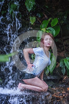 Asia Beautiful girl at waterfall