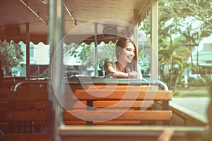 Asia beautiful woman sit on tramcar