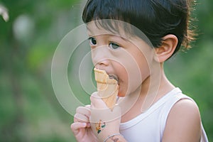 Asia boy he mouth aftertaste from eating chocolate ice cream  or chocolate dessert. A sweet-toothed child eat chocolate. Kid with