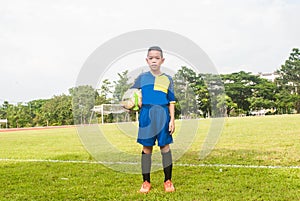 Asia boy playing Soccer football field stadium grass line ball b