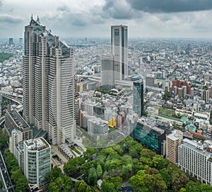 Asia business concept for real estate and corporate construction - panoramic urban city skyline aerial view under rainy sky in