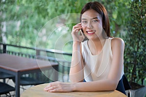 Asia Businessmen and women are using mobile and touch smart phone for Communication and checking on business people in office