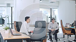 Asia businesspeople chatting to intern discussing job interview colleagues having conversation and communication meeting