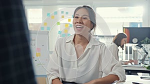 Asia businesspeople chatting to intern discussing job interview colleagues having conversation and communication meeting.