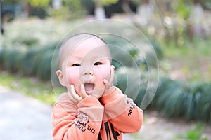 Asia Chinese little baby toddler boy child play outdoor in park forest sunny happy carefree smell flower meadow spring garden