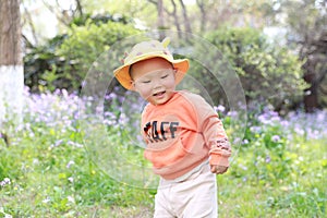 Asia Chinese little baby toddler boy child play outdoor in park forest sunny happy smile carefree flower meadow spring garden