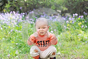 Asia Chinese little baby toddler boy child play outdoor in park forest sunny happy smile carefree flower meadow spring summer