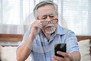 Asia elderly man who has eye pain and poor vision, Long sighted, Glaucoma.