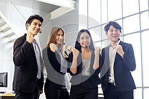 Asia Group of call center workers or Confident business team with headset in office