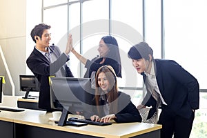 Asia Group of call center workers or Confident business team with headset in office