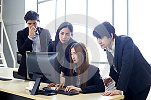 Asia Group of call center workers or Confident business team with headset in office