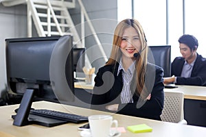 Asia Group of call center workers or Confident business team with headset in office