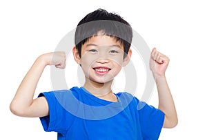 Asia little boy flexing biceps