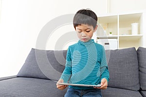 Asia little boy using tablet
