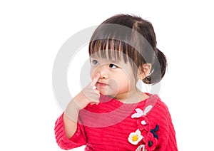 Asia little girl touch her nose