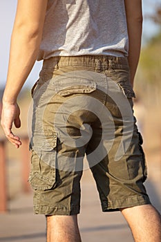 Asia man in bermuda shorts and t-shirt, outdoor activity concept