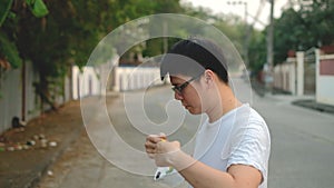 Asia man Stay beside and wear N95 mask for protect bad pollution PM2.5 dust in city