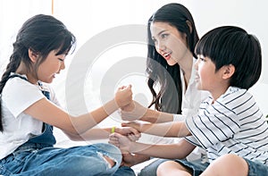 Asia mom playing with her son and daughter, They smile happily, Love, Family ties, Single Mother.