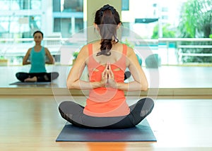 Asia people practicing and exercising vital meditate yoga in class.