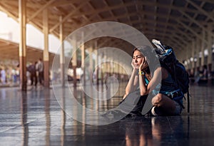 Asia woman with bag backpack and sitting bored wait a time for t