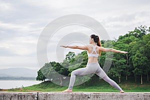 Asia woman doing yoga fitness exercise