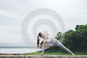 Asia woman doing yoga fitness exercise