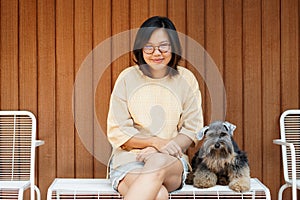 Asia woman with glasses and casual wear clothes with her small b