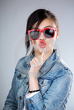 Asia woman pout lip with sunglasses