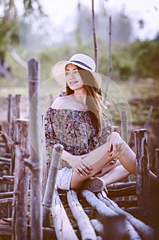 Asia woman in summer fashion sitting on sun