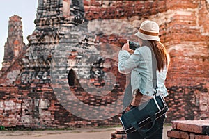 Asia woman take image ancient temple by smarth phone