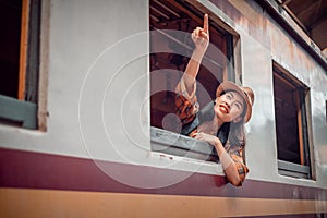 Asia young women tourists sit on the train at Hua Lamphong Station Bangkok Thailand. To Attractions on vacation