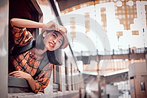 Asia young women tourists sit on the train at Hua Lamphong Station Bangkok Thailand. To Attractions on vacation