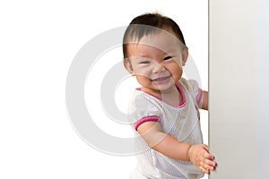 Asian 10 month old baby girl, with cheeky smile