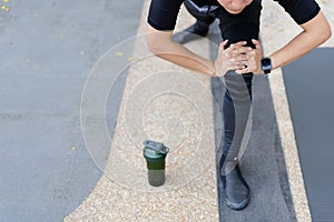 Asian active sportsman making a workout outdoor.