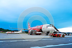 A322 Asian airline passenger plane boarding passengers stairway. At the airport on the island of Langkawi