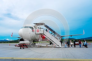 A322 Asian airline passenger plane boarding passengers stairway. At the airport on the island of Langkawi