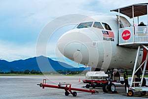 A322 Asian airline passenger plane boarding passengers stairway. At the airport on the island of Langkawi