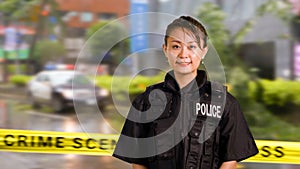 Asian American Police Officer Smiles at Camera