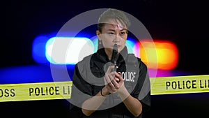 Asian American Policewoman with a pistol