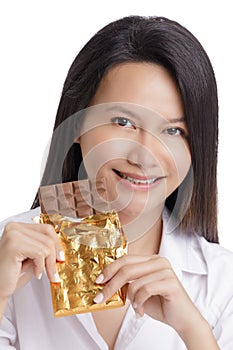 Asian American woman enjoying a Milk Chololate candy bar