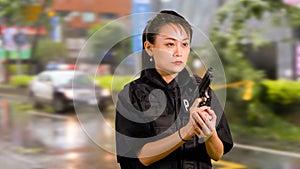 Asian American Woman Police Officer Holding Pistol