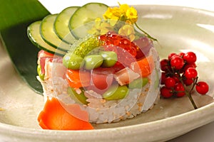 Asian appetizer of rice with tuna, and salmon