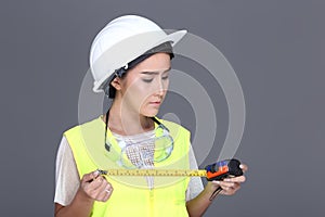 Asian Architect Engineer woman in white hard hat, safety vast, p