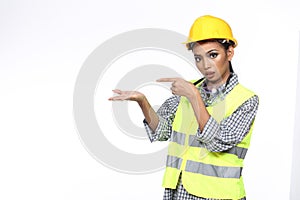 Asian Architect Engineer woman in yellow hard hat, safety vast