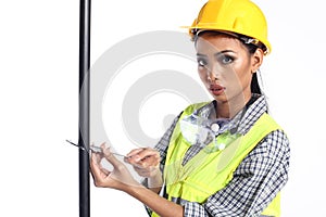 Asian Architect Engineer woman in yellow hard hat, safety vast