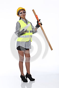 Asian Architect Engineer woman in yellow hard hat, safety vast